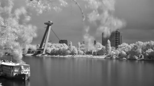Panoramic view of buildings by sea against sky