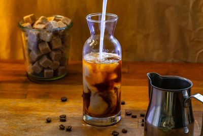 Close-up of drink in glass jar on table