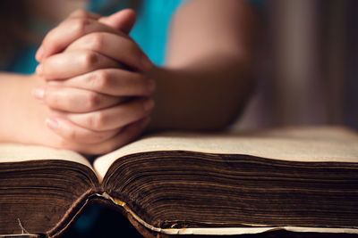 Close-up of woman reading book