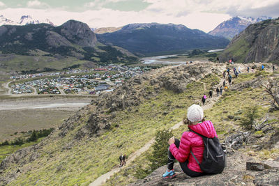 Rear view of woman walking on mountain