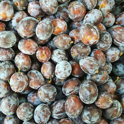 Full frame shot of plums for sale at market stall