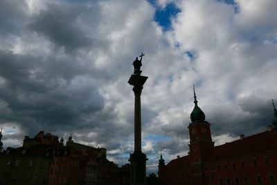Low angle view of building against cloudy sky