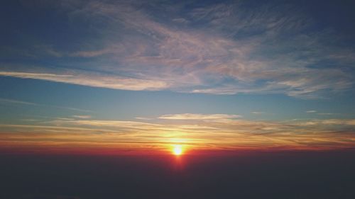 Low angle view of dramatic sky during sunset
