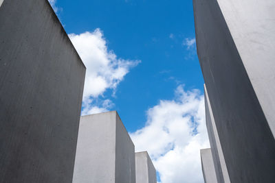 Low angle view of building against cloudy sky