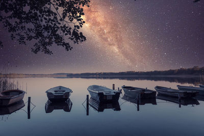 Scenic view of lake against sky at night