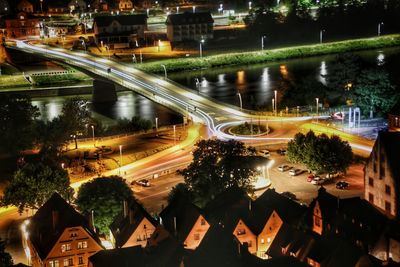 High angle view of light trails on city street at night