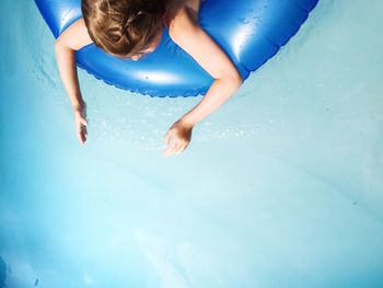 Woman jumping in water