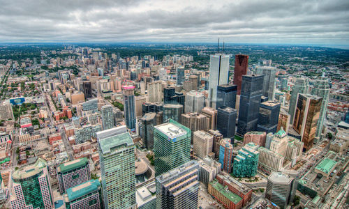 High angle view of modern buildings in city against sky