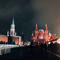 People on city street at night