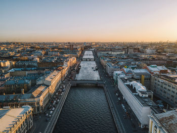 Aerial sunset cityscape of fontanka river in saint petersburg, russia. bridges across river. 