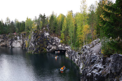 Rear view of man walking on rock