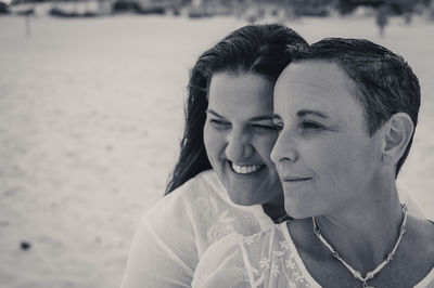 Portrait of smiling couple on beach