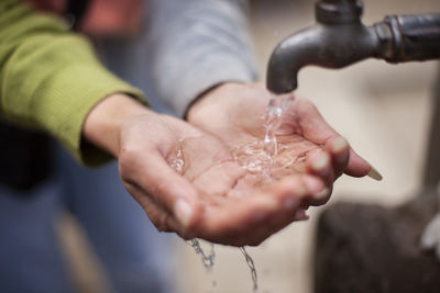 Close-up of hand holding water