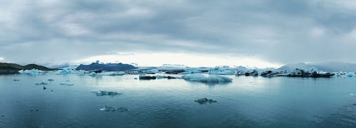 Scenic view of frozen lake against sky