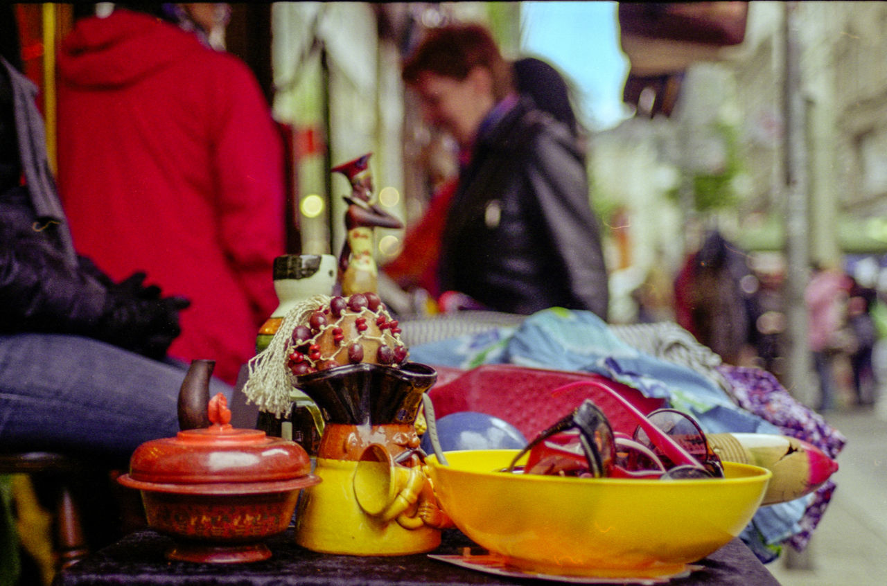 real people, food and drink, men, focus on foreground, freshness, food, women, fruit, outdoors, midsection, day, two people, healthy eating, people