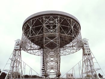 Low angle view of communications tower against sky