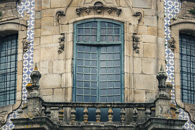 Low angle view of window in old building