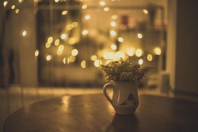 Close-up of illuminated christmas lights on table