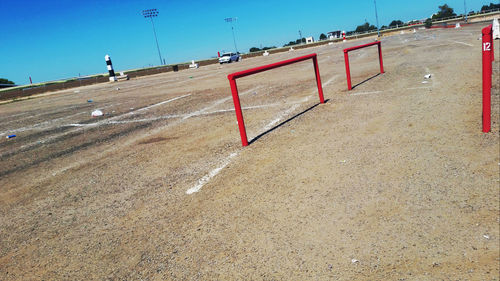 Scenic view of beach against clear blue sky