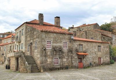 Old building in town against sky