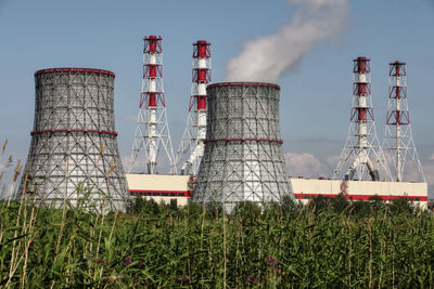 Low angle view of factory against sky