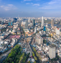 High angle view of buildings in city against sky