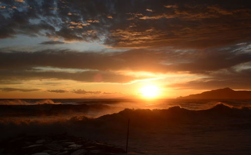 Scenic view of dramatic sky during sunset