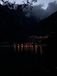 Scenic view of lake against sky at night