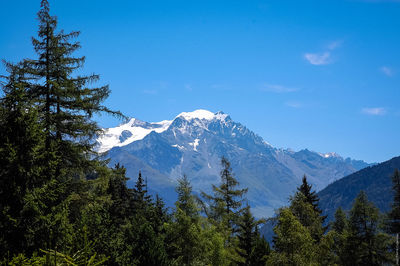 Scenic view of mountains against cloudy sky