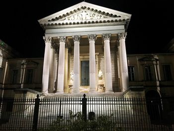 Low angle view of statue at night