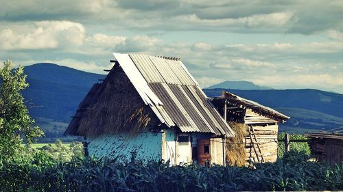 Built structure on mountain against sky