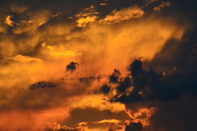 Low angle view of dramatic sky during sunset