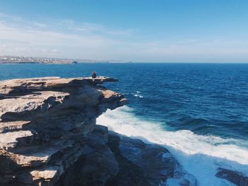 Scenic view of sea against blue sky