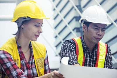 Low angle view of man working at construction site