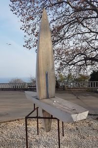 Table and trees against sky