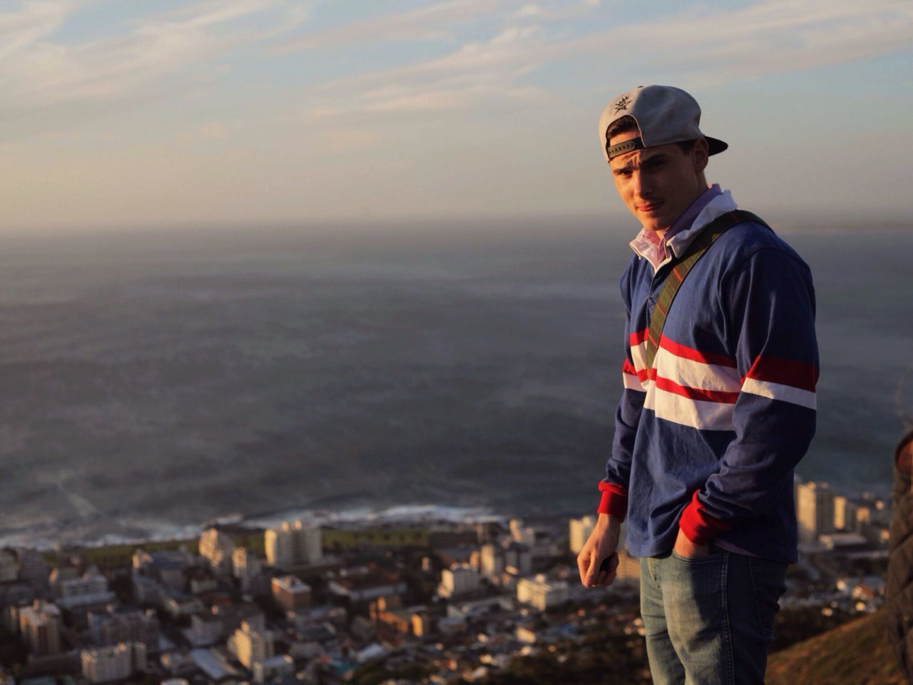 lifestyles, standing, casual clothing, leisure activity, men, rear view, sky, three quarter length, young men, sunset, cloud - sky, warm clothing, hooded shirt, waist up, full length, focus on foreground, looking at view, photography themes