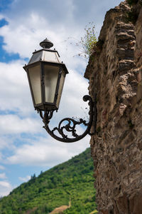 Low angle view of street light against sky