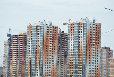 Skyscrapers in city against sky