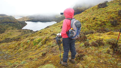 Tourist taking a photo in the cayambe coca national park
