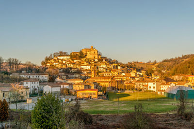 Buildings against clear sky in city