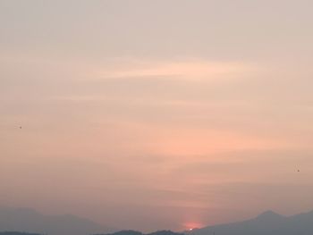 Low angle view of cloudy sky during sunset