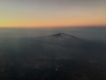 Scenic view of landscape against sky during sunset