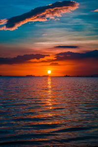 Scenic view of sea against romantic sky at sunset