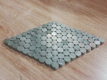 High angle view of coins on table