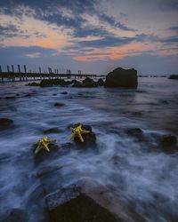 Scenic view of sea against sky during sunset