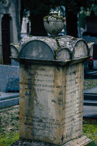 Close-up of cross in cemetery