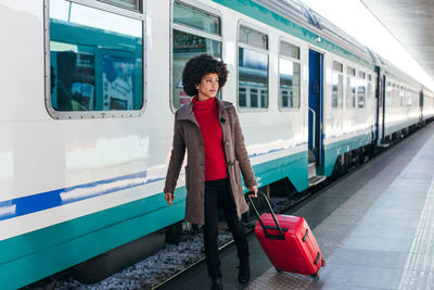 Tourist woman going for vacation trip on train