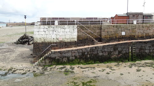 Damaged building against sky