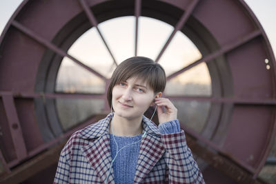 Portrait of smiling woman standing outdoors