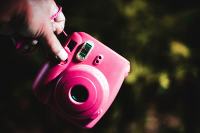 Close-up of hand holding pink toy